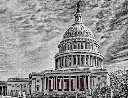 Inaugural flags drape the U.S. Capitol..