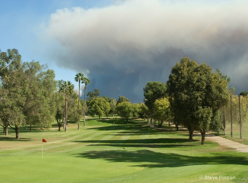 Tranquil golf course, threatening skies