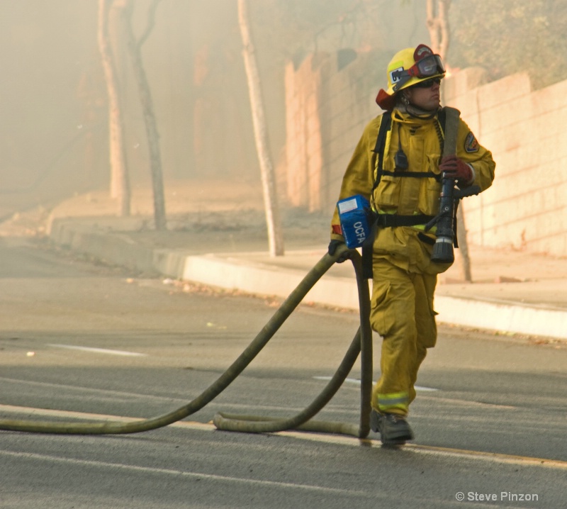 Fireman readying hoses - ID: 7850513 © Steve Pinzon