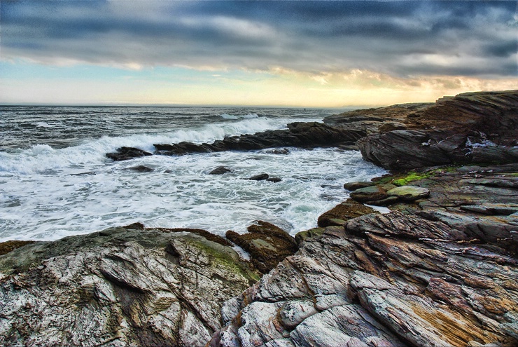Weather over rocky shore