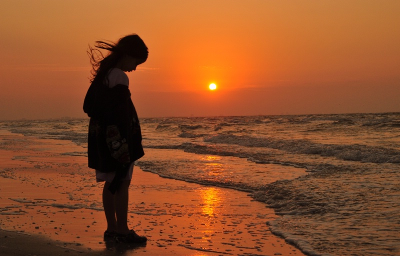 Waiting for the water to reach her feet !