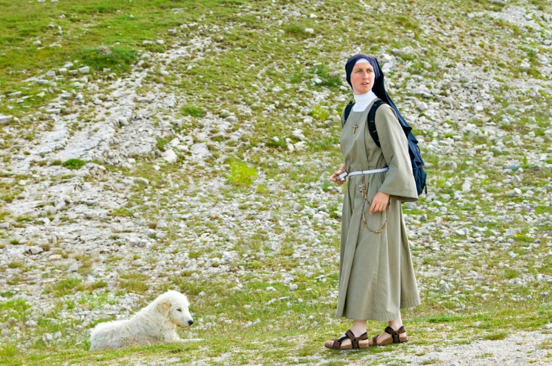 Nun with sheep Dog, Hills above Piano Grande - ID: 8231332 © Larry J. Citra