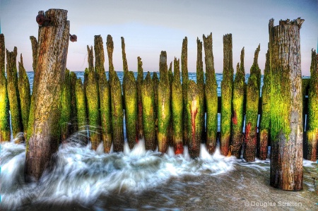 Rushing Waters through Jagged Pier