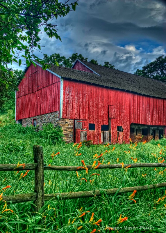 red barn with clouds