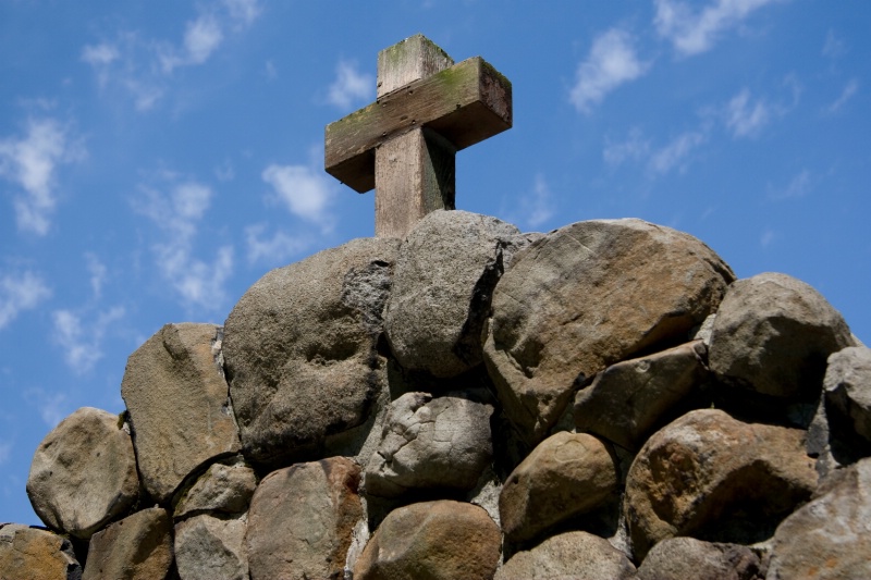 Wooden Cross on a Rock Hill