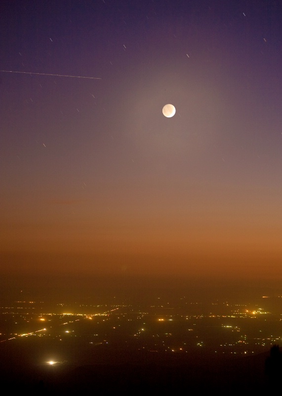 City lights and hazy moon