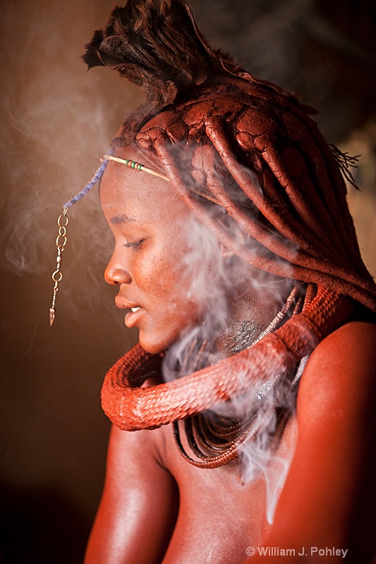 Himba woman bathing with aromatic smoke (9235) - ID: 9403199 © William J. Pohley