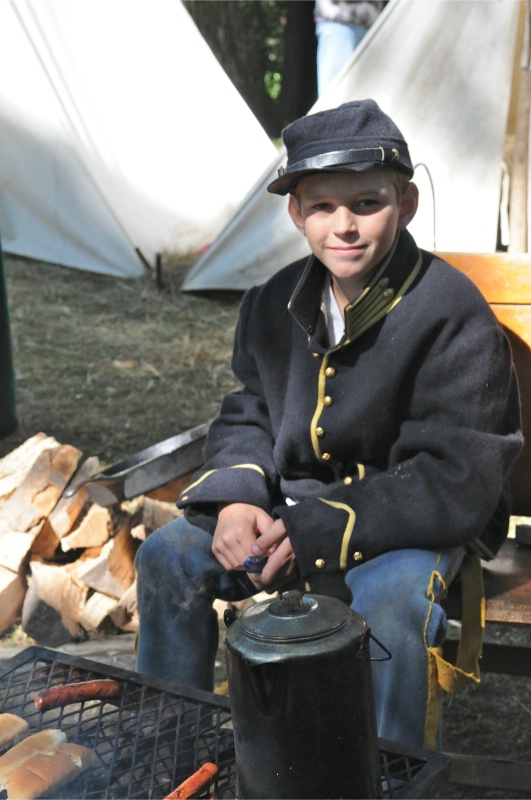 Young Union soldier at campfire