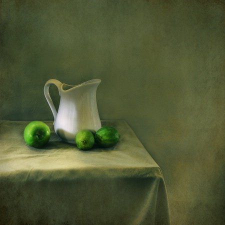 Still life with apple and limes