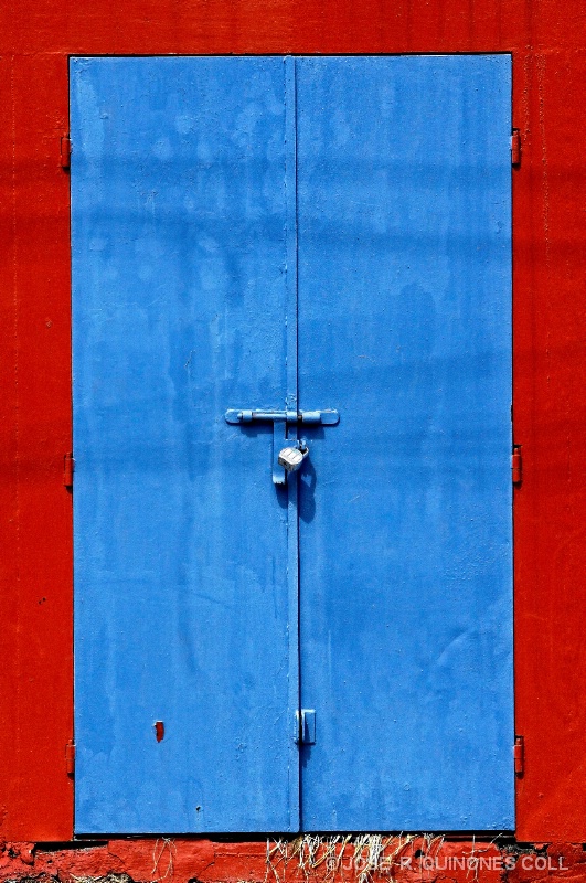 BLUE DOORS  ON RED WALL
