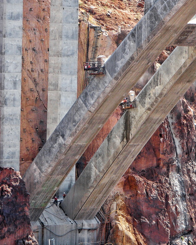 Workers achor bridge at Hoover Dam
