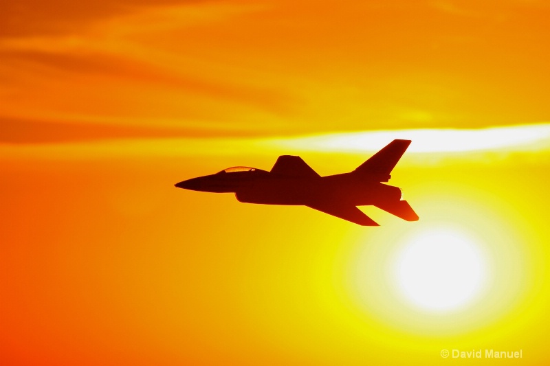 fighter jet at sundown