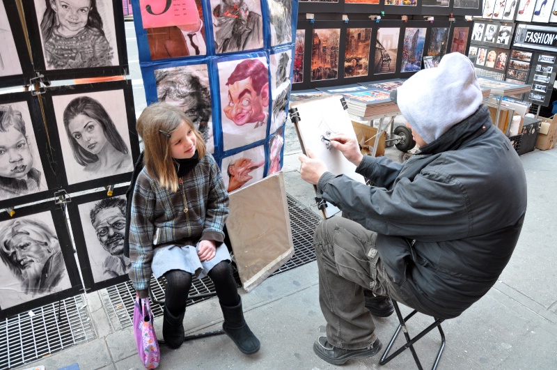Maggie getting sketched in Time Square
