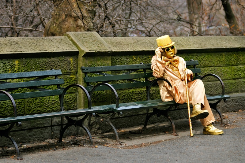 New Yorker sitting on a bench, waiting.