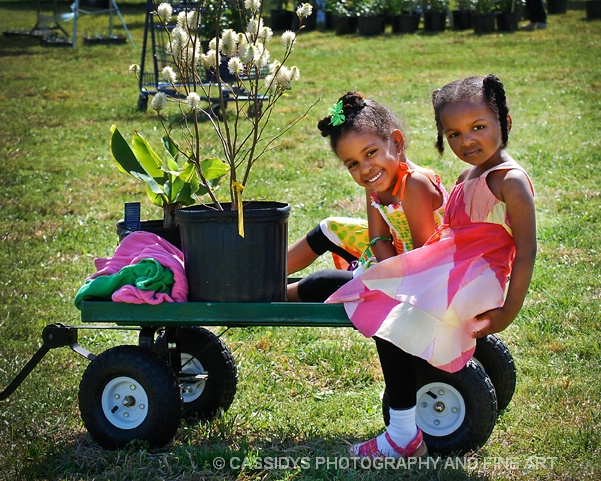 two little girls plant shoppin