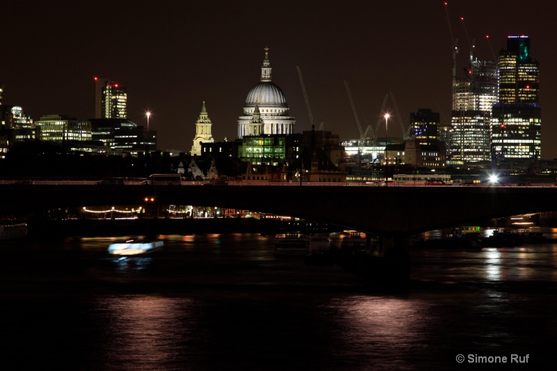 view of St. Paul at night on the Thames River