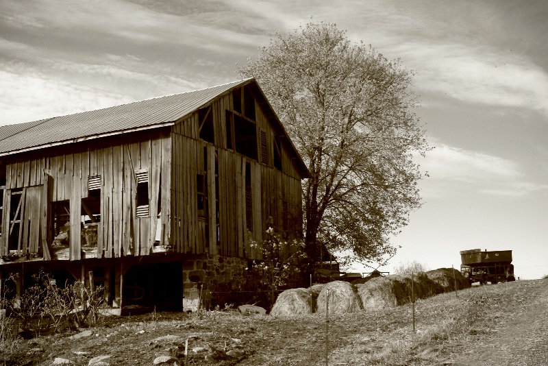 Old barn with hay bales.