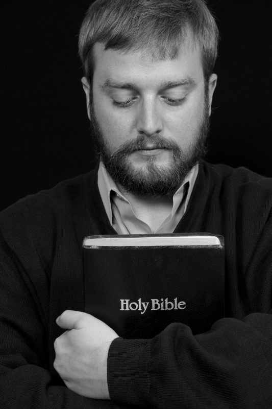 Contemplation--Young Man Holding a Bible