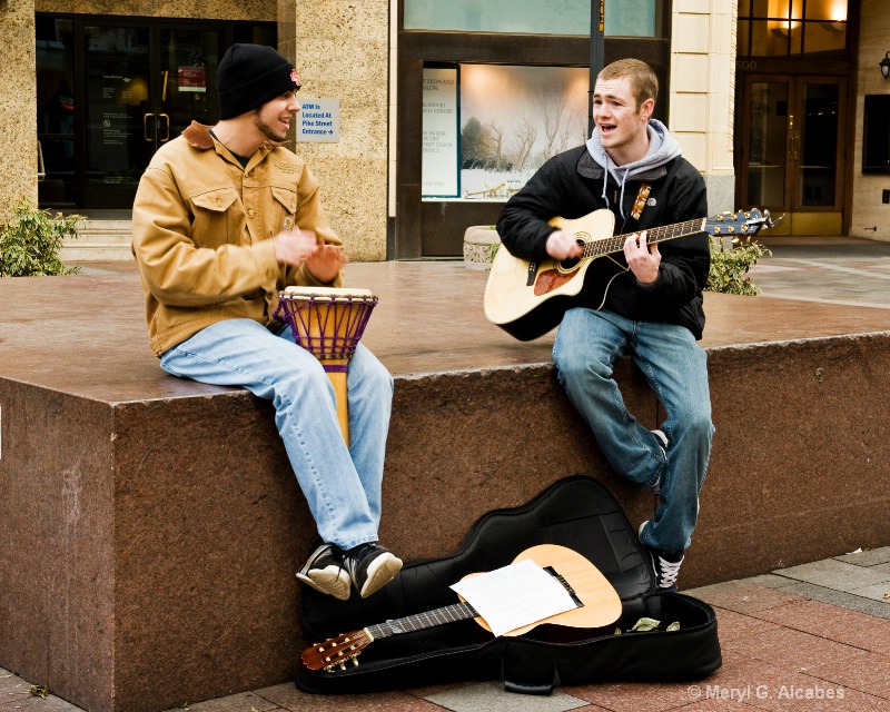Two young men singing and interracting