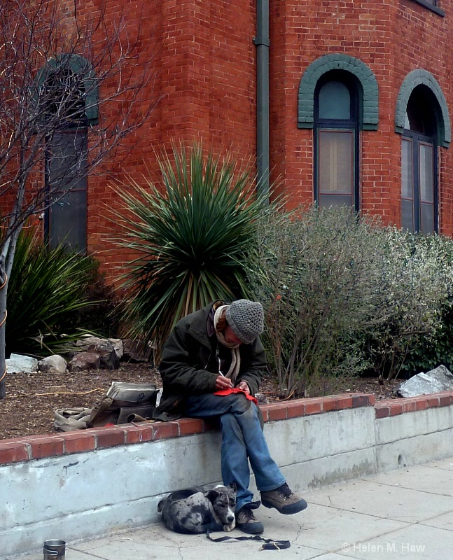 a sidewalk artist at work