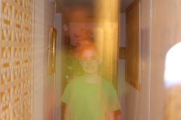 Son standing in front of hallway