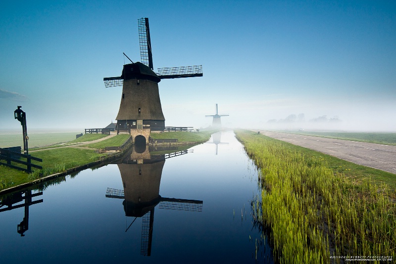 Windmills in the Early Morning Mist