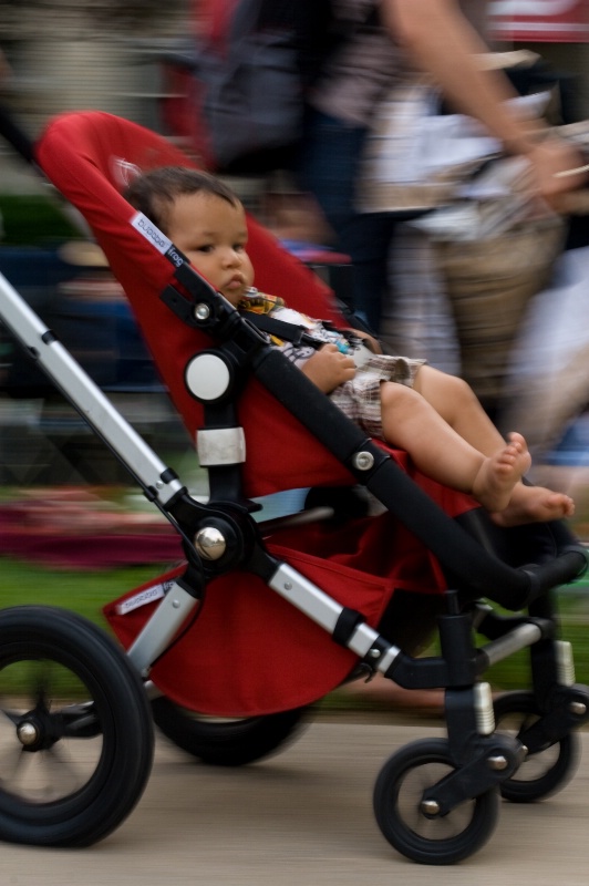 Baby in Red Stroller