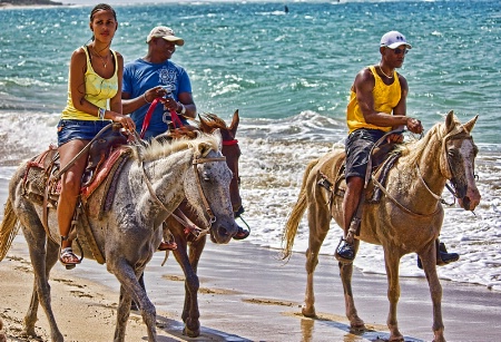 Horseback Riding On The Beach