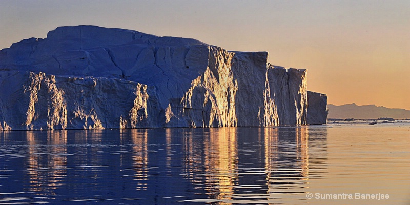 giant icebergs in the midnight sun  greenland