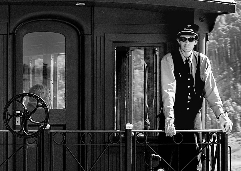 Train Conductor and Passenger