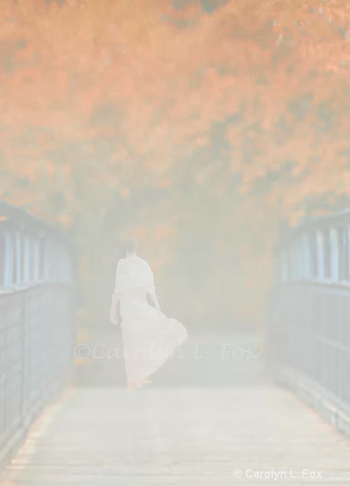 Woman in pink on the foggy bridge