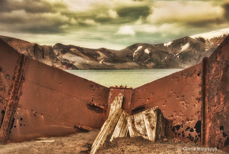 Behind rusted tanks, Antarctica
