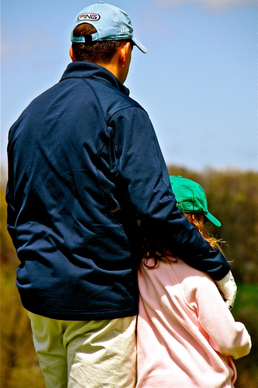 Father-Daughter Enjoying the Game