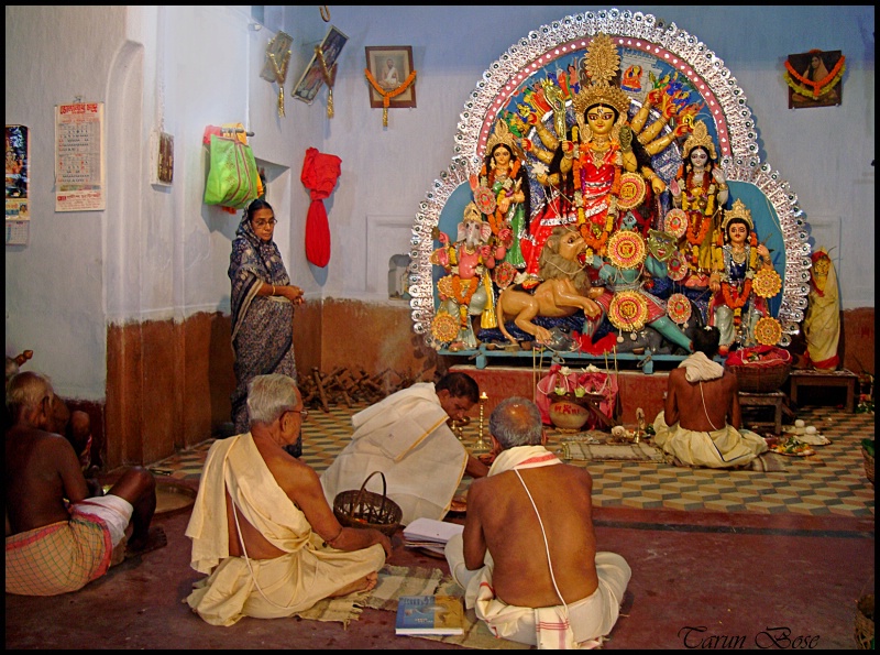 Worshipping goddess Durga.