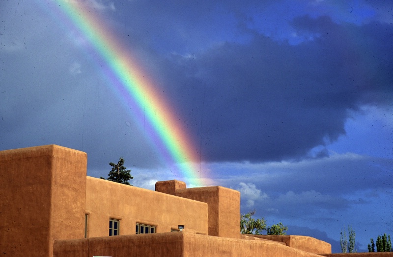 Rainbow over adobe building in Santa Fe, NM