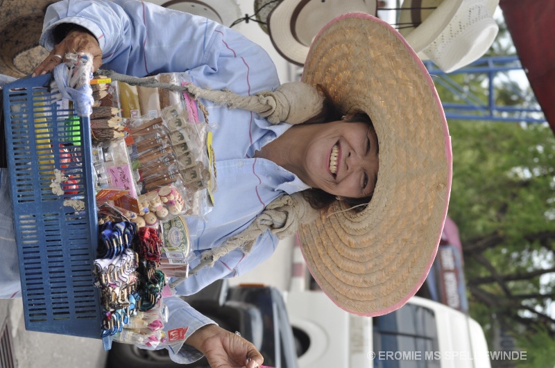 Thai lady selling ornaments and incense sticks