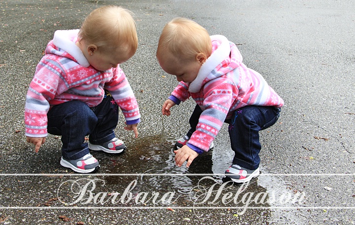 Little girl and little puddles. 