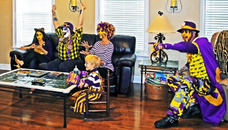 LSU face paint family watches game on TV
