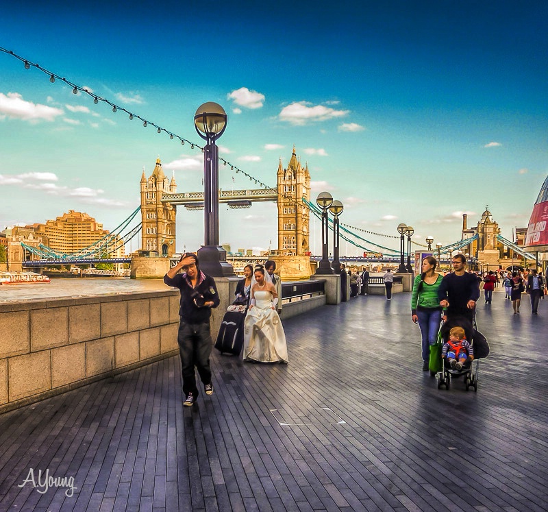 THE TOWER BRIDGE  PHOTOGRAHER AND INFANT..