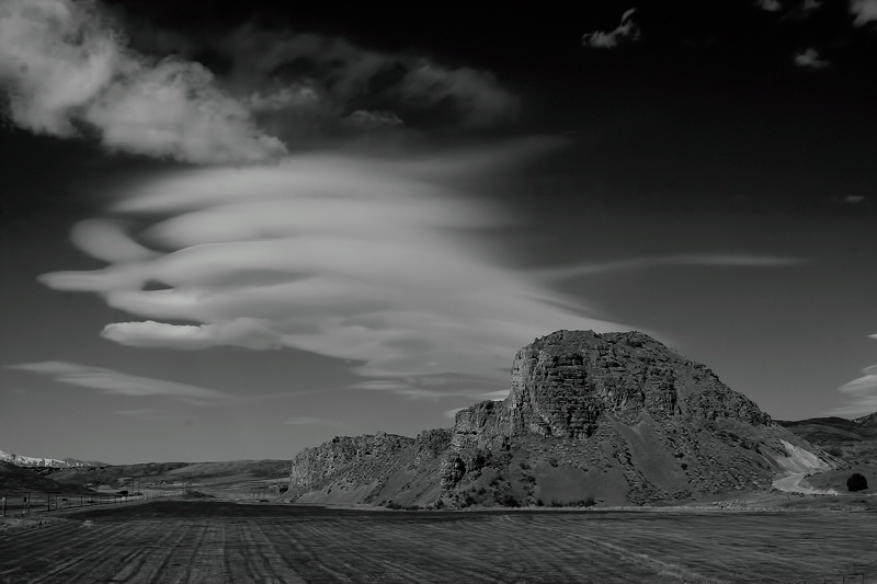 Clouds over rock formation