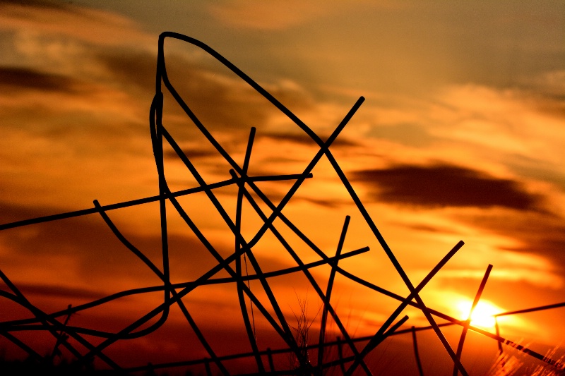 Mangled Fence at Sunset