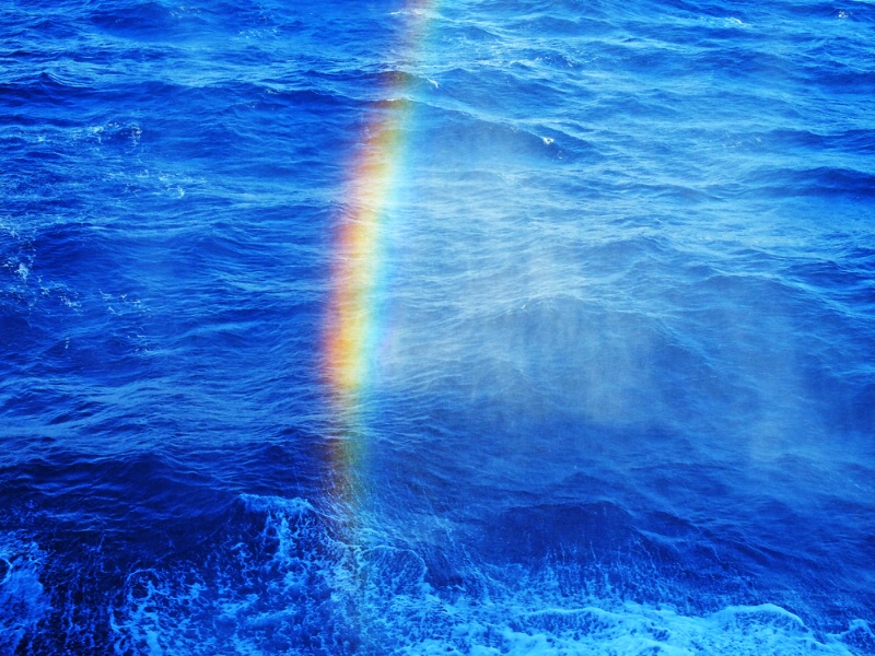 Rainbow at sea drizzling