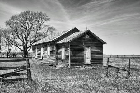 one room schoolhouse in pasture field