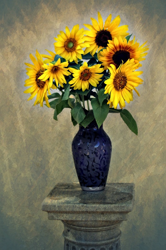Sunflowers in Purple Vase