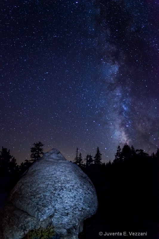 Light painting on a rock with the Milky Way