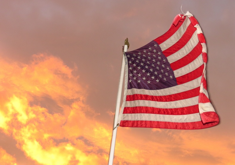 old glory waving in the sunset