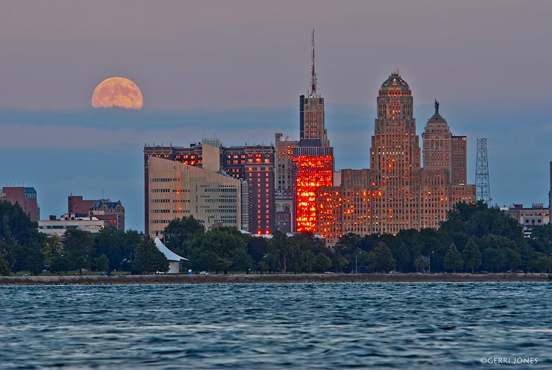 Moonrise Over City Skyline
