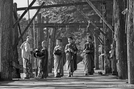 Morning alms on the bridge.