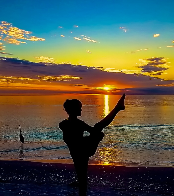 Yoga at the Beach posing as Bird of Paradise
