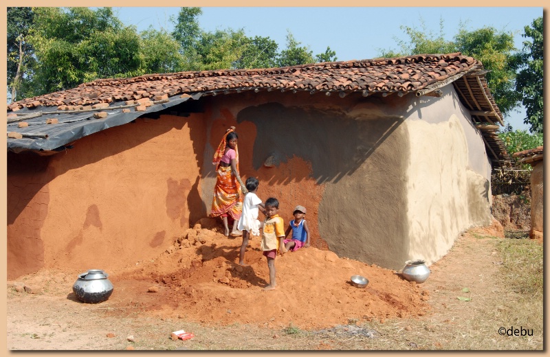 Mud Hut painted with red clay soil and the bo